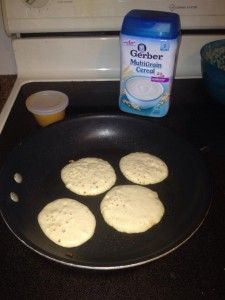 an image of some food cooking in a pan on top of a stove with the words baby pancakes using baby food and baby cereals