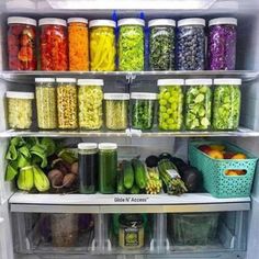 an open refrigerator filled with lots of different types of vegetables and fruit in containers next to each other