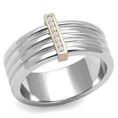 Description This two-tone rose gold stainless steel women's ring sets new parameters of style with it's sleek design. A hue of rose gold on the steel highlights the top-grade crystals attached to the ring. it's subtlety makes it suitable for all occasions. Product Features: Stainless steel ring for women Clear color top grade crystal stones Stone shape: round Band style: traditional Two-tone rose gold ion plated finish Made from highly corrosive resistant TK316 Stainless Steel Ring size: women's 10 Weight (approx): 6.43 (g) Material(s): stainless steel/crystal Pack of 2 Product Specifications Weight Width Height Depth 0.01 LBS 3.00" 3.00" 3.00" Warning: CHOKING HAZARD-Small Parts Adult Supervision Required. Buy Gold And Silver, Luxe Jewelry, Trendy Fashion Jewelry, Stainless Steel Ring, Cz Ring, Stainless Steel Band, Stainless Steel Rings, Steel Ring, Wedding Rings For Women