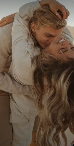 two women embracing each other in the desert