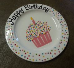 a birthday plate with a cupcake on it