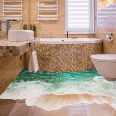 a bathroom with an ocean themed floor that looks like it is floating in the water