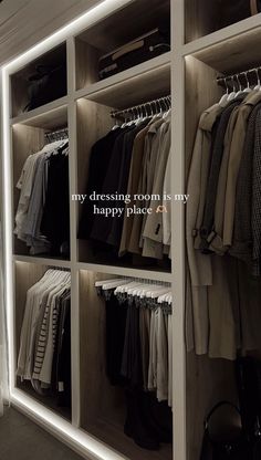 a closet with clothes hanging on the walls and a quote that reads, my dressing room is my happy place