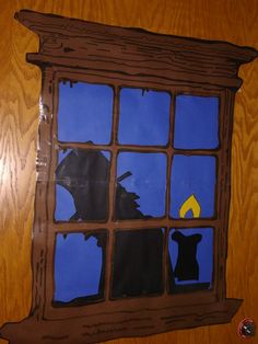 an image of a window with a dog looking out at the night sky through it