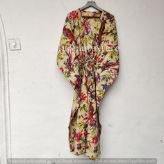 "This Beautiful Indian Cotton Caftan Or Can Be Called As Tunic Is Made With Super Fine Quality Cotton And Designs Have Been Crafted By Hand Prints. Measurements :- Size - Free Size Length - 55 Inch / 140 Cm Bust/Chest Size - 33 Inch / 83 Cm Fabric - 100% Cotton Pattern - Floral Caftan Has Adjustable Drawstring Waist To Loose Or Tight , Caftan Has V Shape Neck Which Is 8\" Inches Deep. Caftan Is Multi-Purpose And Can Be Worn As A Cover Up At The Beach ,Lounge Wear ,Sleepwear ,Pregnant Women Hospi Beige Floral Print Beach Kimono, Traditional Summer Wrap Kaftan, Bohemian Floral Print Wrap Maxi Dress, Traditional Wrap Kaftan For The Beach, Printed Wrap Kaftan For Vacation, Traditional Floral Print Kimono For Summer, Traditional Floral Print Summer Kimono, Traditional Summer Kimono With Floral Print, Multicolor Tropical Kaftan With Kimono Sleeves