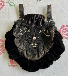 Antique Victorian style black handbag/sack bag.  Leather handles with stitched unique design with dainty rhinestones here and there. Satin drawstring lining. Very unique! See pictures for dimensions. Victorian Bags Vintage Purses, Pouch Purse, Bags Vintage, Sack Bag, Black Handbag, Vintage Purses, Vintage Victorian, Coin Purses, Purse Pouch