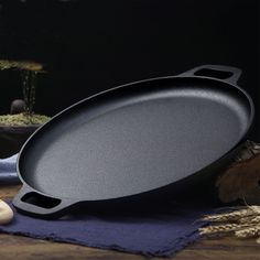 a cast iron skillet sitting on top of a table