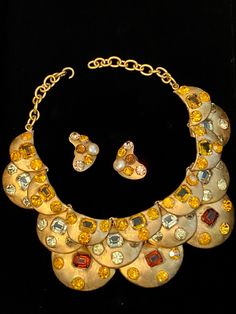 "Unsigned Italian necklace and earrings by Baroness Luciana Aloisi de Reutern, who designed for Gucci and Elizabeth Arden and also exported directly to the United States. Circa 1965. Also known as Luciana di Roma. Author Denna Farneti Cera states on p. 221 in her book Amazing Gems: \"Luciana's unusual genius enlivened the costume jewelry world beginning in the war years and then led to her even greater reputation in the coming years. In her book European Designer Jewelry - Ginger Moro says \"Luc Elegant Gold Jewelry Sets With Stones, Gold Round Jewelry Sets For Evening, Gold Multi-stone Costume Jewelry, Evening Multi-stone Yellow Gold Jewelry, Evening Yellow Gold Multi-stone Jewelry, Yellow Gold Multi-stone Jewelry For Evening, Designer Multi-stone Gold Jewelry, Elegant Gold Multi-stone Jewelry Sets, Gold Jewelry With Stones For Evening