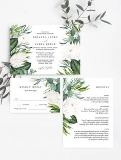 wedding stationery with white flowers and greenery on the front, green foliage on the back