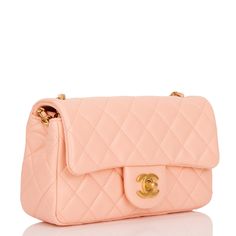 This Pearl Crush Mini Rectangular flap bag is of peach lambskin with antique gold tone hardware and has a front flap with signature CC turnlock closure, rear half moon pocket, single interwoven peach leather and antique gold tone chain link shoulder/crossbody strap with adjustable "pearl" ball. The interior is lined in peach leather and features a zipper pocket with Chanel pull and an open pocket below. Collection: 2021 (RFID Chip) Origin: Italy Condition: Pristine; new or never Accompanied by: Chanel box, Chanel dustbag, ribbon and retail UPC Measurements: 8" width x 5" height x 2.5" depth; 22.5" strap drop Chanel Pearl Crush, Chanel Pearl, Dream Bags, Chanel Box, Chanel Pearls, Chanel Bags, Suitcases, Flap Bag, Lambskin Leather