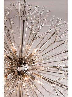 The nature-inspired Dunkirk Collection is sure to attract attention. A modern, stylized version of a dandelion puff, each branch of this chandelier is bedazzled with a crystal sphere, luminously refracting the light outward. This bold design is a unique addition to your dining room, bedroom, or entry.Dimensions: 24" H x 20" D. Canopy: 5 1/4" D. Height is adjustable using the included 54" chain. Lighting: 8 candelabra base sockets rated for 60W each. Firework Design, Ceramic Light, Arm Chairs Living Room, Candelabra Bulbs, Hudson Valley Lighting, Burke Decor, Crystal Sphere, Light Chandelier, Aged Brass