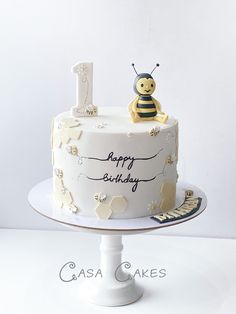 a birthday cake with a bee on top