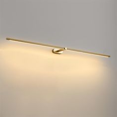 a light that is on the side of a wall with a long pole attached to it