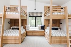 bunk beds in a room with windows and white carpeted flooring on both sides