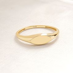 Here is Signet Ring Gold 14K! Our Custom 10K 14K 18K Gold Engraved Initial Ring will be perfect Mindful Ring for Girl, best friend or girlfriend! This Personalized Alphabet Stackable Ring is Comfortable Fitting Ring for daily life.  Dainty Dainty Letter Pinky Ring will be either exciting gift for Girl, Bestie, Daughter or New Best friends. This Stunning 14K gold signet ring or custom initial ring also Lovely oval signet ring will be best alphabet ring and symbolizes your love and serves as the ideal gift for your girlfriend or Daughter. You can check our other signet rings in here : https://www.etsy.com/shop/minifinejewels?ref=seller-platform-mcnav&section_id=40429776 Ring Details Band:14K Carat:585 Quality : AAA+ Band Width: 1.40 mm Band Thickness: 1.30 mm  Front Width: 9x4 There are 585 14k White Gold Birthstone Ring With Polished Finish, Oval Yellow Gold Stackable Rings Tarnish Resistant, Gold Oval Birthstone Stackable Ring, Gold Oval Stackable Birthstone Ring, Hallmarked Oval Birthstone Ring In 14k Gold, Heirloom Style 14k Gold Stackable Engraved Ring, Heirloom 14k Gold Stackable Engraved Ring, Heirloom Engraved Stackable 14k Gold Ring, Fine Jewelry Yellow Gold Stackable Signet Ring