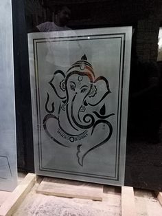 an elephant is depicted in a glass window