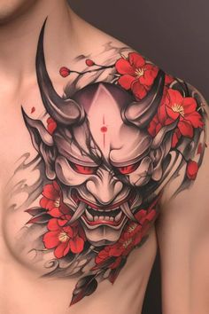 a man with tattoos on his chest and red flowers