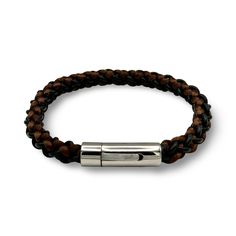 This stylish and sophisticated men's bracelet, is a must-have accessory for the modern man. Handcrafted with care and attention to detail, this bracelet features a combination of quality materials and a sleek design. The band is hand braided by leather and silk cords and it adds a touch of rugged elegance, while the stainless steel clasp ensures durability and a secure fit.  Whether you're dressing up for a special occasion or adding a touch of edge to your everyday look, this men's bracelet is the perfect choice. It's a statement piece that effortlessly elevates any outfit and makes a great gift for yourself or the fashionable gentleman in your life. Bracelet can be complimented with a matching keyring.  It comes in a velvet pouch for safe-keeping when not in use. Gift wrapping option is Modern Leather Braided Bracelets, Modern Leather Braided Bracelet With Black Band, Modern Braided Leather Bracelets With Black Band, Modern Leather Braided Bracelet For Everyday, Modern Braided Bracelets With Stainless Steel Clasp For Everyday, Modern Everyday Braided Bracelet With Stainless Steel Clasp, Modern Leather Bracelet With Stainless Steel Clasp For Business, Luxury Adjustable Braided Leather Bracelets, Luxury Adjustable Leather Braided Bracelets