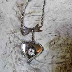 Marc Jacobs Extremely Rare Heart Watch Pendant Necklace Heart Clock With Enamel Love Birds, Purple On One Side, Needs New Battery Timeless Silver Heart Pendant Jewelry, Timeless Silver Heart Jewelry, Timeless Heart Shaped Sterling Silver Jewelry, Timeless Heart-shaped Sterling Silver Jewelry, Silver Stainless Steel Open Heart Jewelry, Timeless Silver Locket Jewelry, Silver Stainless Steel Jewelry And Watches As Gift, Timeless Silver Jewelry For Valentine's Day, Timeless Heart Charm Jewelry For Formal Occasions