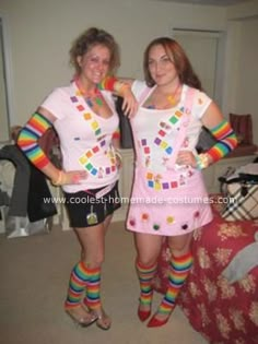 two women dressed in costumes posing for the camera