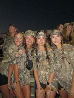 the girls are all dressed in camo