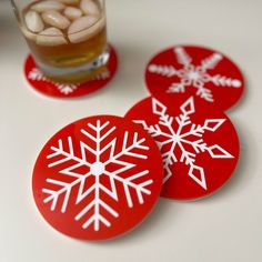 "This is a snowflake coaster set made from Red and White acrylic. The set of Christmas coasters includes 4 different snowflakes designs.  Spruce up your holiday decor with this custom snowflake coaster set. These make great hostess gifts, teacher gifts or stocking stuffers. SIZE The coasters are 4\" in diameter. Laser cut from 1/8\" Red Acrylic and inlaid with 1/8\" white acrylic.  Everything is applied to a base of 1/8\" white acrylic to protect your surfaces. LINKS TO ADDITIONAL COLORS Black Snowflake Coaster Set https://bauergiftsco.etsy.com/listing/1347562745/black-snowflake-coaster-set-christmas Green Snowflake Coaster Set https://bauergiftsco.etsy.com/listing/1333549670/snowflake-coaster-set-christmas-coaster Wood Snowflake Coaster Set https://bauergiftsco.etsy.com/listing/1076046817 Christmas Acrylic Decoration, Ceramic Christmas Coasters, Christmas Coaster Ideas, Christmas Coasters Diy, Christmas Red Decor, Diy Christmas Coasters, Coaster Design Ideas, Christmas Crafts To Sell Make Money, Winter Coasters