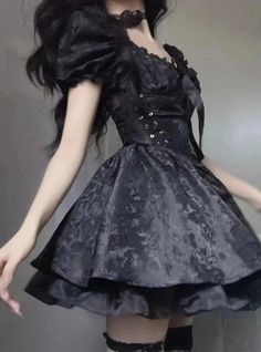 This Cute Gothic Puffy Dress is a beautiful amalgamation of sweet Lolita charm and gothic allure. The dress features puffed sleeves that can be worn off-shoulder for a romantic look, while the fitted bodice is accentuated with corset-like lacing that offers both an elegant silhouette and an adjustable fit. Its luxurious black fabric is patterned with subtle floral lace, adding depth and texture. The skirt flares out into a playful, yet sophisticated bell shape, finished with a ruffled hem that e Dark Tiger, Unique Clothing Stores, Techwear Fashion, Gothic Grunge, Puffy Dresses, Gothic Dress, Sweet Lolita, Corset Style, Puffed Sleeves