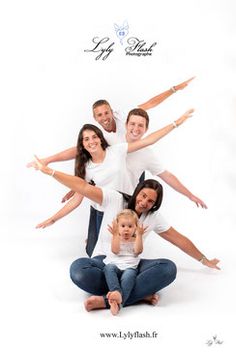 a family posing for a photo in front of a white background with the words happy birthday written on it