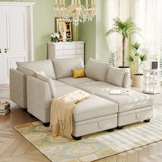 a living room filled with furniture and a chandelier