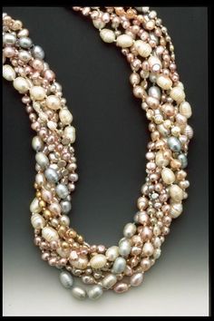 The first photo is a promo pic from 20 or more years ago. The one I have available is in the remainder of photos. 9 strands of freshwater pearls, all hand knotted on silk culminating in a hand braided buttonhole clasp. Copper coated clay bead at clasp. Close out item. Length 20". Original price $400 Magical Jewelry, Pearl Jewellery, Artful Home, Pearl Necklaces, Freshwater Pearl Necklace, Freshwater Pearl Necklaces, Beaded Necklaces, Strand Necklace, Clay Beads