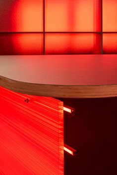 an empty table with red lights in the background