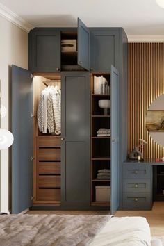 an open closet in the corner of a bedroom