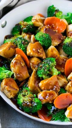 broccoli, carrots and chicken in a white bowl with the words healthy chicken and broccoli recipe