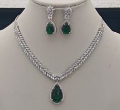 Meena Green CZ Diamonds Necklace Earrings Jewellery Set, Bridal Dangler Earrings, Bridal V Shape Necklace, Party Wear Silver Necklace ITEM DESCRIPTION Metal        = Silver Plated Occasion  = Wedding, Party Wear, Bridal Color        =  As per your order Size          = Necklace Length = 14 CM Long, Earring Size = 4 CM Inches Necklace Weight = 34 Gram Earrings Weight  = 6 Gram This necklace set comes with two matching earrings and a silver plated chain.  Free Shipping 100% Satisfaction Guarantee: Diamond V Necklace, Jewellery Set Bridal, Diamonds Necklace, Dangler Earrings, Jewellery Set, Cz Diamond, Necklace Earrings, V Shape, Matching Earrings