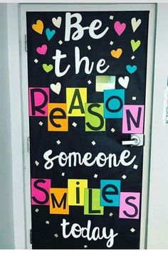 a door decorated with the words reason someone smiles for us to see in this classroom