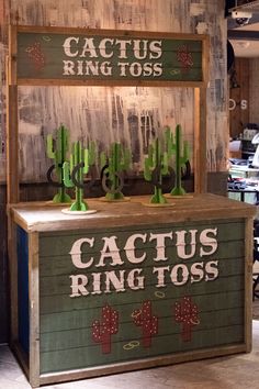 the cactus ring toss booth is set up for customers