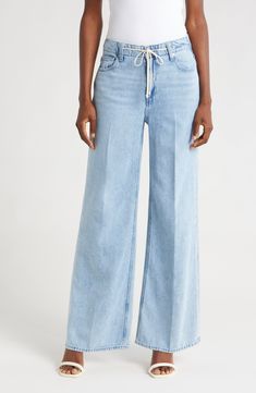 A tie at the high waist adds weekend-ready style to full-length, casual-chic wide-leg jeans made from soft, nicely draped nonstretch denim. 30 1/2" inseam; 22" leg opening; 11 1/2" front rise; 16" back rise (size 29) Tie waist Five-pocket style 60% cotton, 40% lyocell Machine wash, tumble dry Imported Light Wash Wide Leg Flare Jeans For Work, Wide Leg Light Wash Flare Jeans For Work, Spring Denim Flare Jeans For Elevated Casual, Modern Light Wash Flare Jeans For Spring, Modern Light Wash Spring Flare Jeans, Spring Flare Jeans For Elevated Casual Occasions, Elevated Casual High Rise Jeans For Spring, Elevated Casual Wide Leg Denim Flare Jeans, Versatile High Rise Wide Leg Pants For Summer