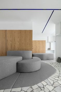 an unusual couch sits in the middle of a room