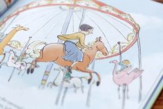 an open children's book with pictures of people riding on horses and carousels