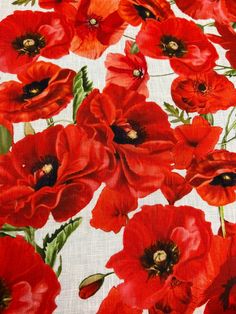 red flowers on white fabric with green leaves