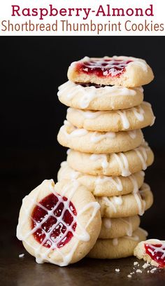 a stack of cookies with white icing and jelly on top