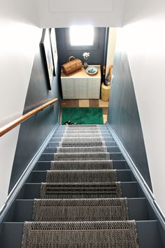 the carpeted stairs lead up to the second floor