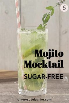 mojito cocktail with lime, mint and sugar in a tall glass on a wooden table