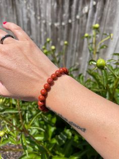 "Engage with the world around you better with this Red Jasper crystal Bracelet!  Boost your confidence with this Red Jasper Bracelet. Red Jasper gives a sense of wellbeing, intensifying that feeling. By bringing inner stability and strength, Red Jasper allows you to provide peaceful energy in your relationships. It is believed that Jasper has the ability to create and help balance aggressive, dynamic energy.  Other healing properties: ~ Power ~ Nurturing Energy ~ Mastering your Fears ~ Reduces Inflammation ~ Improves Focus ~ Living in the Present  ~ Manifestation ~ Leadership Chakra: Sacral & Root Zodiac: Libra & Scorpio Each gemstone bracelet is handmade with polished, 8mm round beads & stretchy string. The bracelet's length is 7.5\" inches, stretchy enough to fit most peoples' wrists. Th Spiritual Red Beaded Bracelets For Everyday, Red Spiritual Beaded Bracelets For Everyday, Red Jasper Crystal, Red Jasper Bracelet, Peaceful Energy, Jasper Bead Bracelet, Libra Scorpio, Jasper Bracelet, Healing Crystal Jewelry