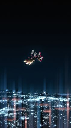 two birds flying in the night sky over a cityscape with buildings and skyscrapers