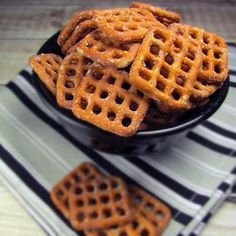 a bowl filled with waffles on top of a table