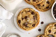 chocolate chip cookies and milk on a table