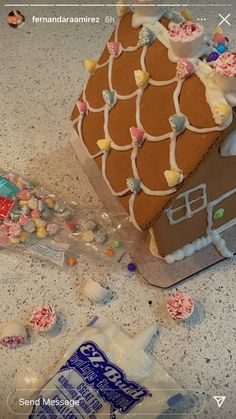 a gingerbread house with candy and candies around it