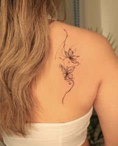 a woman with a tattoo on her back