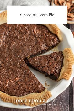 chocolate pecan pie on a plate with one slice missing